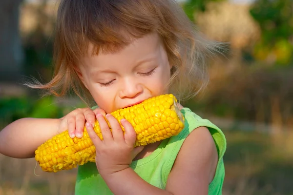 Child to eat boiled corncob