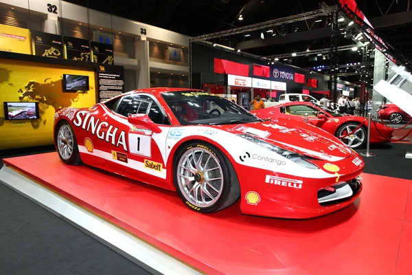 Red Ferrari car display at Bangkok International Auto Salon 2013 on June 20, 2013 in Bangkok, Thailand.