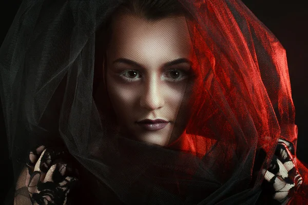 Mysterious Woman Portrait. Beautiful Model Woman Face Closeup