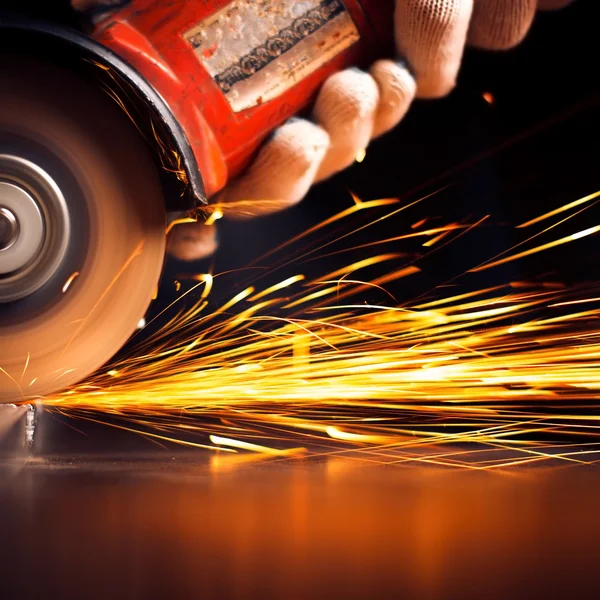 Red hot sparks at grinding steel material
