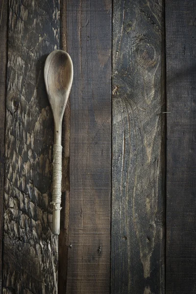 Wooden kitchenware on gbrown background