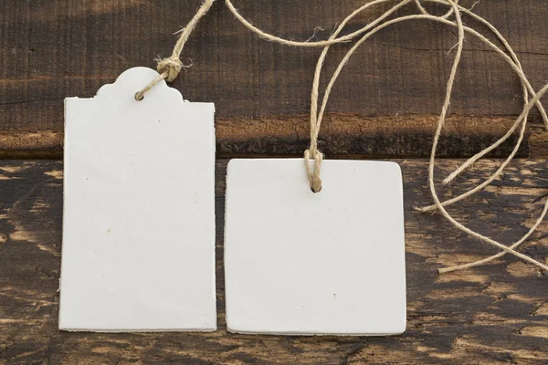 Blank tag,  rectangular and square, on wooden background