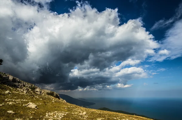 Cloud over a cliff