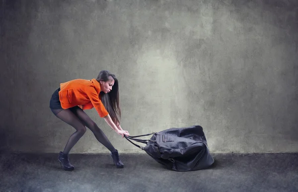 Woman carrying heavy bag