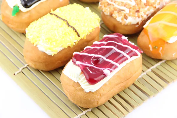 Mix color Sushi Donuts in bamboo dish.