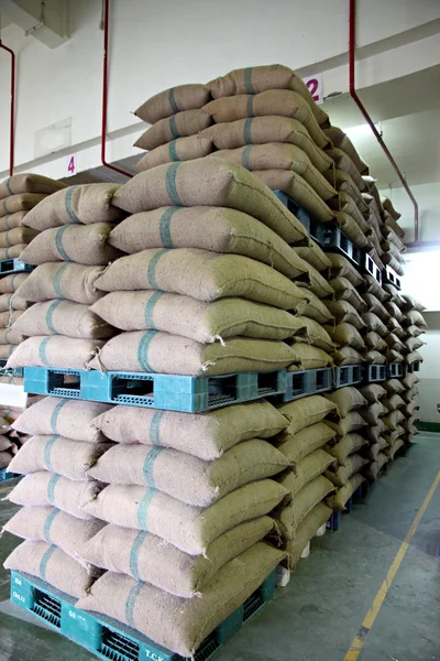 Stacked of Rice sacks in warehouse.