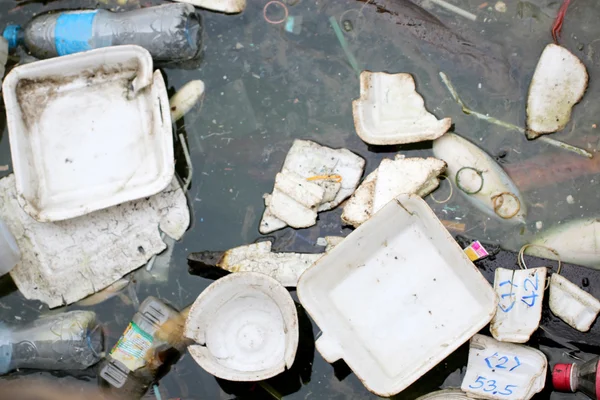 Rubbish floating in the sea.