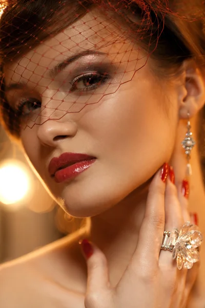 Retro woman wearing hat with veil