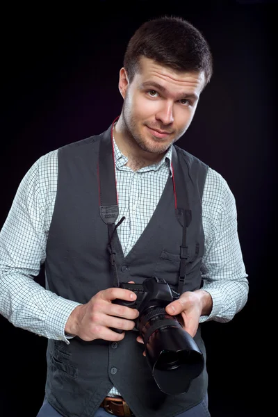 Cute photographer with camera in hand