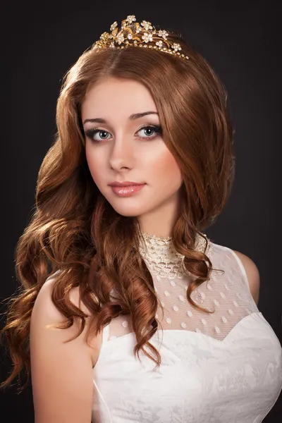 Beautiful bride red hair woman in wedding dress with bridal makeup and hairstyle. Fashion madel girl. perfect skin and long healthy glossy hair . beauty contest winner. Princess.