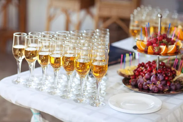 Champagne glasses on wedding table, party