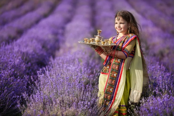 Indian girl with traditional plate of religious offerings