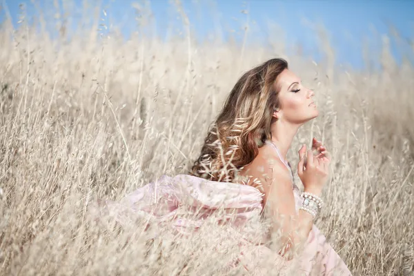 Beautiful sexy woman in field Outdoor portrait