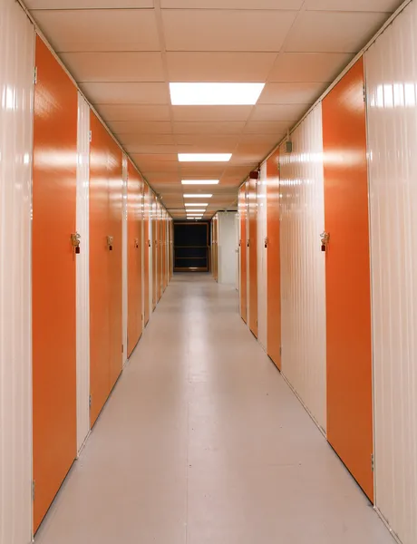 Self Storage Corridor with Red Doors