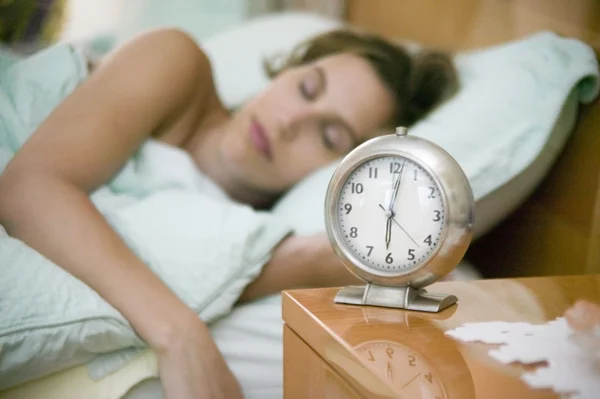 Woman and alarm clock