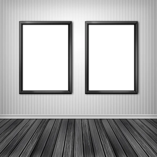 Two empty frames on a wall