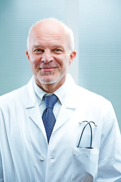 Successful senior male doctor smiling