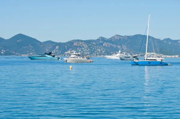 Beautiful yachts on a sparkling blue sea in Cannes, France