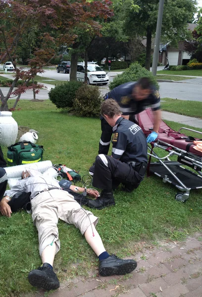 Ambulance Worker with Patient