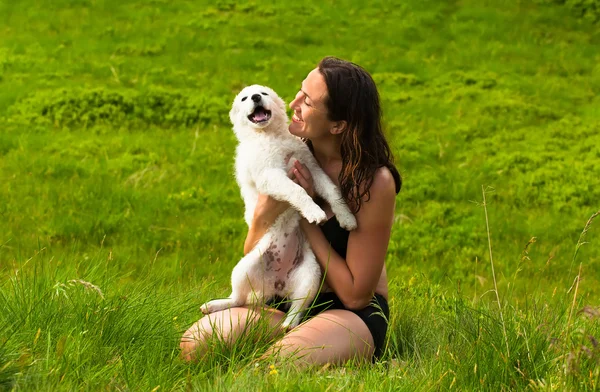 Girl playing with her dog outdoor