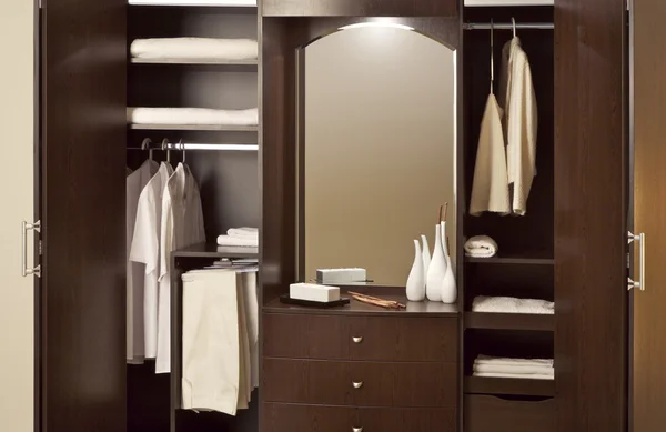 Open wardrobe with clothes