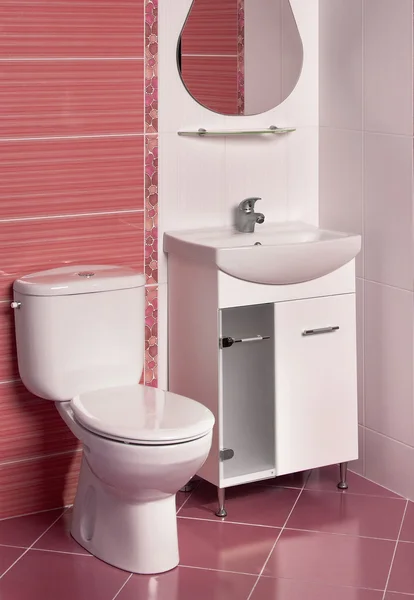 Detail of a modern bathroom interior in red and white