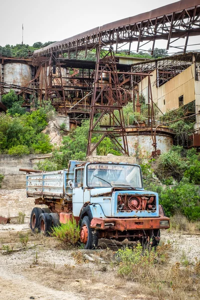 Abandoned truck in a cave