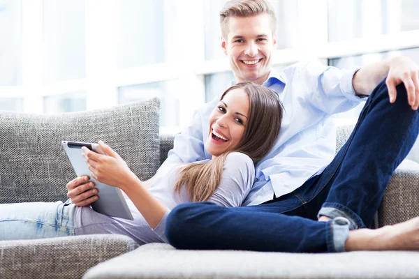 Couple using digital tablet