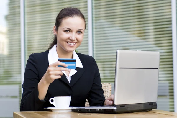 Woman with laptop and credit card