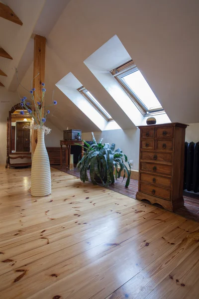 Cloudy home - attic with a pine wood floor — Stock Photo #35595789