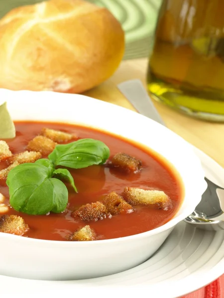 Tomato soup with croutons and bread