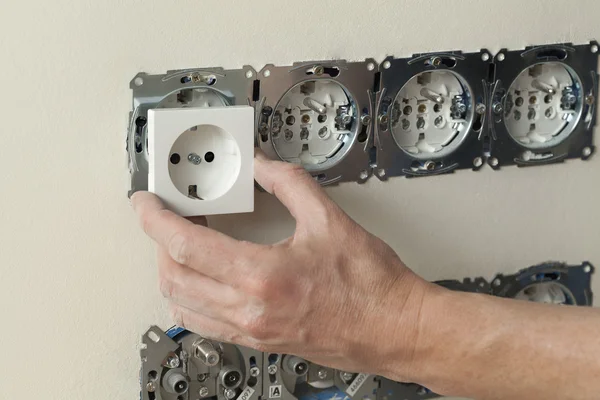 Fitting a cover of power socket