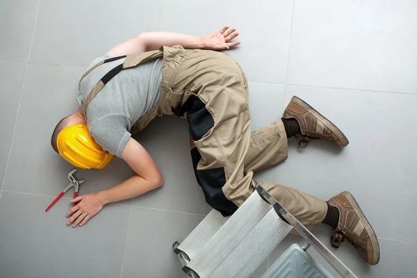 Unconscious handyman on the floor