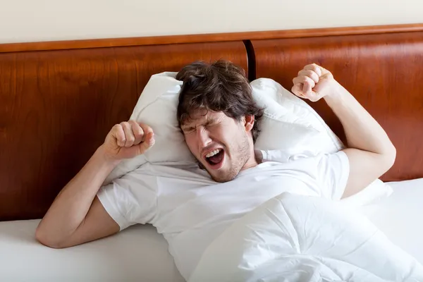 Yawning man after awakening