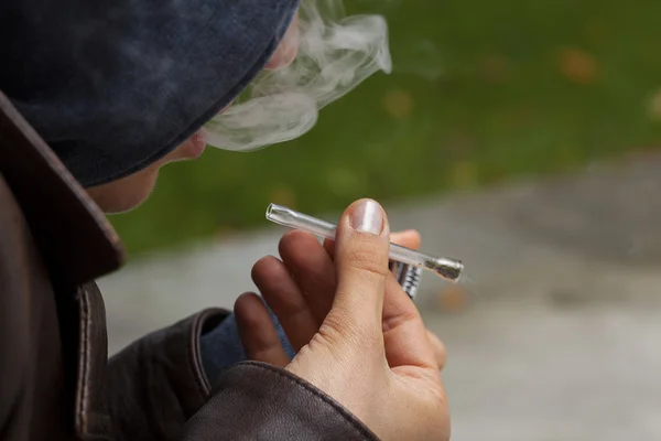 Young boy smoking marijuana