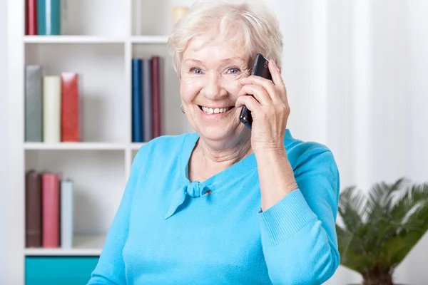 Elderly woman talking on the phone