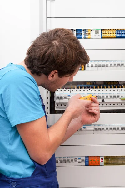 Young repairman checking voltage