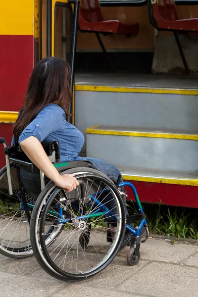Woman of wheelchair having problem with public transport