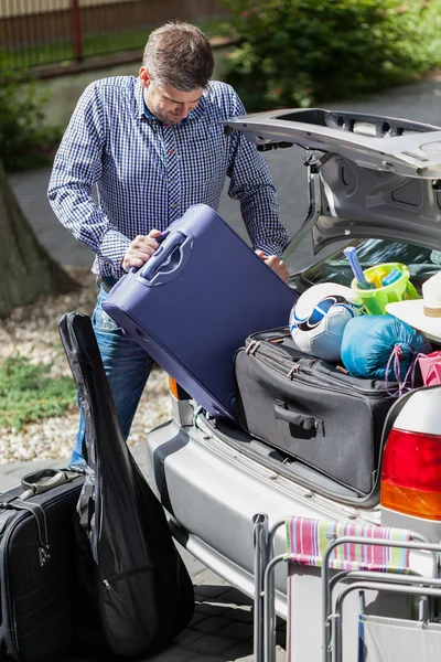 Man during preparation for family travel