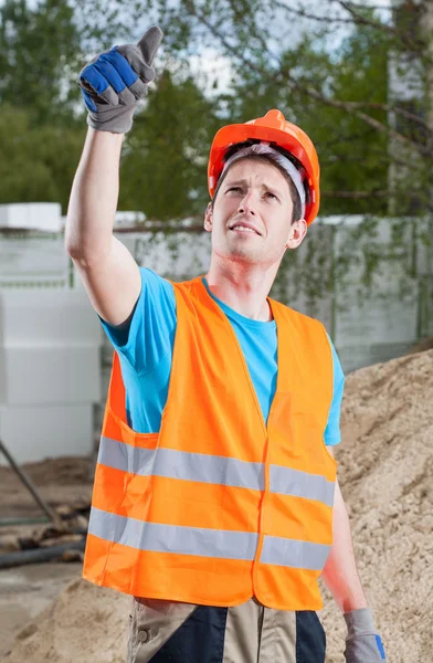 Manual worker showing thumbs up sign