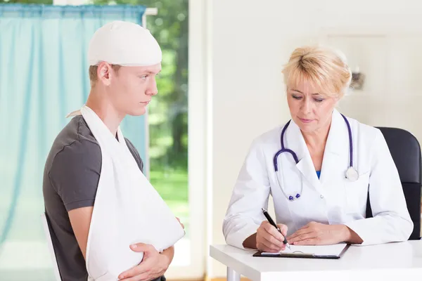 Boy visiting doctor after accident