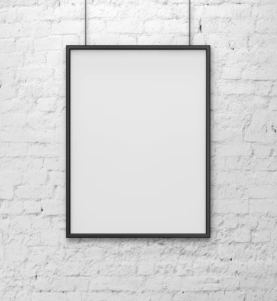 Blank frame on white brick wall
