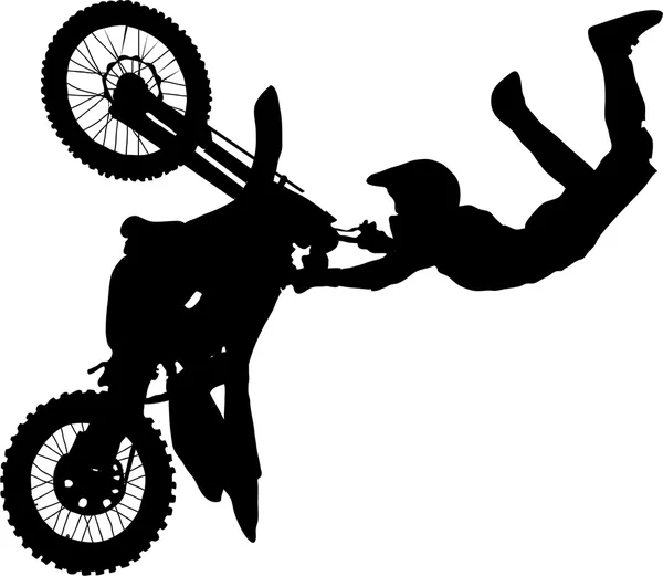 Silhouette of motorcycle rider performing trick