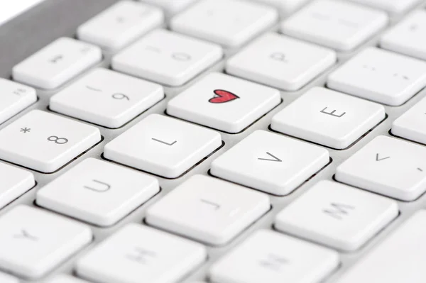 Keyboard with heart spelling th eword LOVE