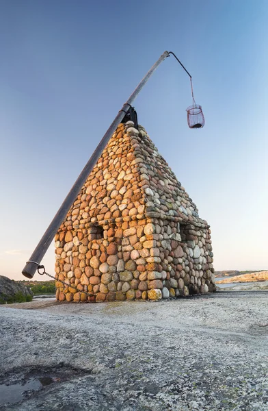 Stone Fishing Building on Rocky Coastline in Norway