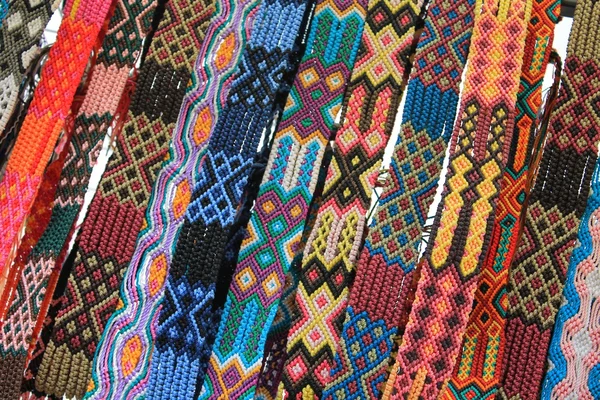 Macrame belts for sale at Mexican craft market