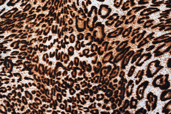 The fabric of motifs leopard on background