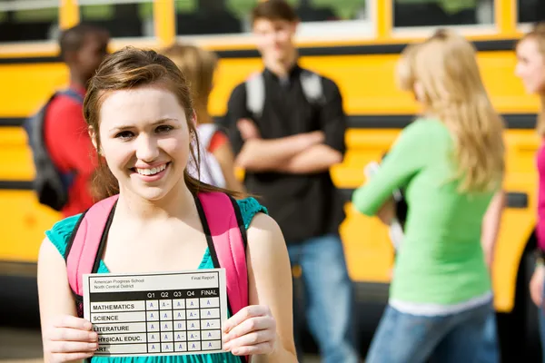 School Bus: Girl Student Has Great Report Card — Stock Photo #24216183