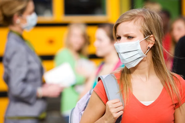 School Bus: Girl Has to Wear Mask to Avoid Disease
