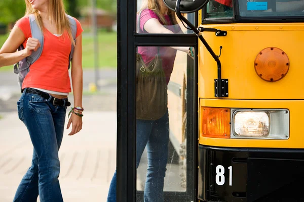 School Bus: Anonymous Students Boarding Bus — Stock Photo #24216639